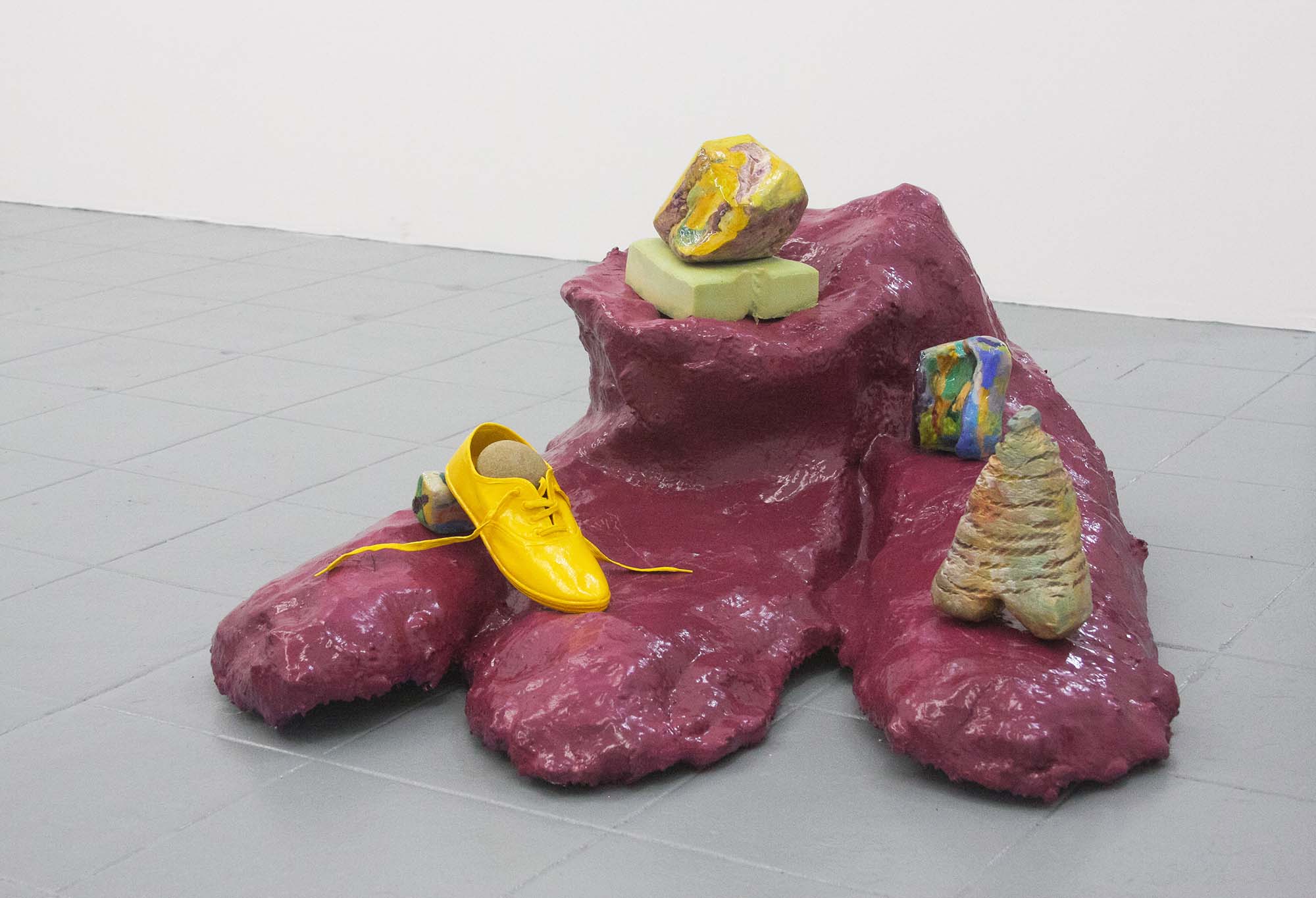 Kim Garcia, all fours, forton, enamel, acrylic latex paint, and standing stones. 2019